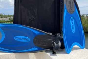 Suitcase and Swim Fins for a Vacation on Grand Cayman Island
